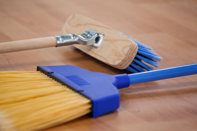 Two sweeping brooms on wooden floor - Download Free Stock Photos Pikwizard.com
