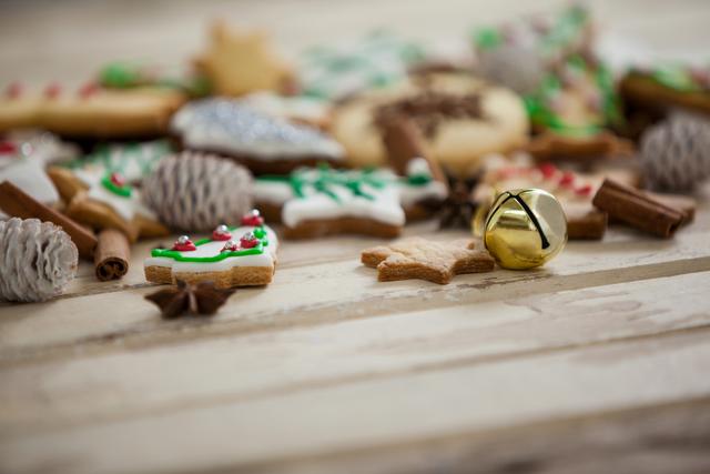 Christmas cookies with jingle bell on a plank
