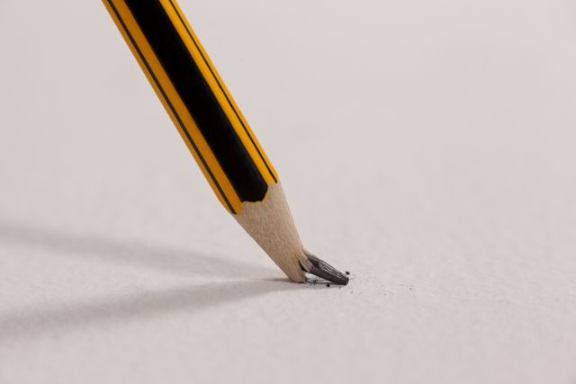 Broken pencil on white background - Download Free Stock Photos Pikwizard.com