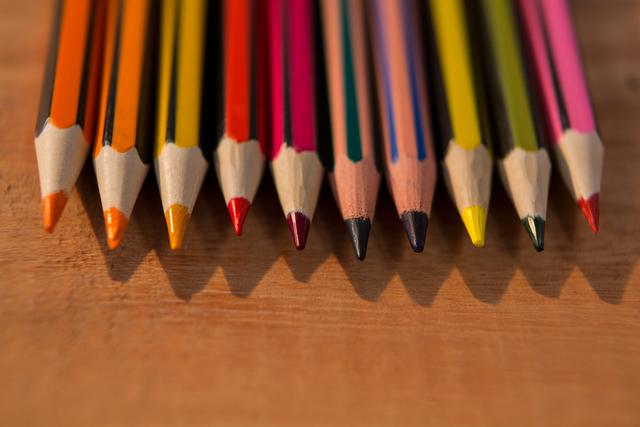 Various color pencils on wooden table - Download Free Stock Photos Pikwizard.com