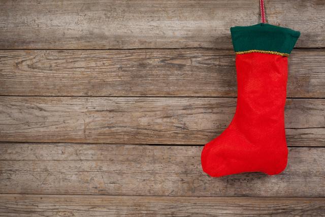 Christmas stocking on wooden wall during christmas time