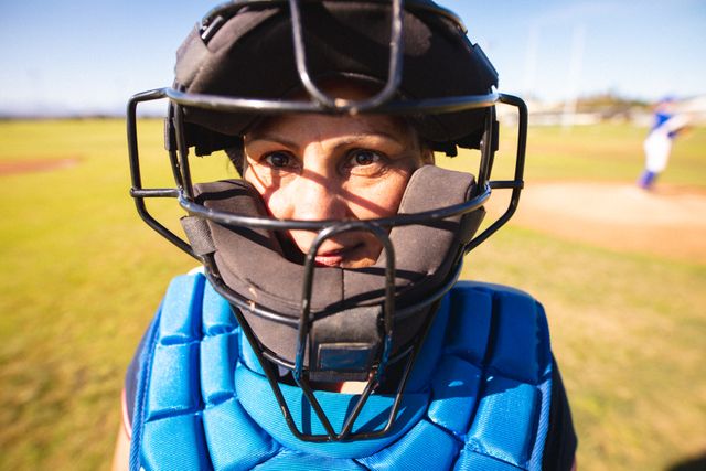 Caucasian female baseball player wearing batting helmet looking to camera - Download Free Stock Photos Pikwizard.com