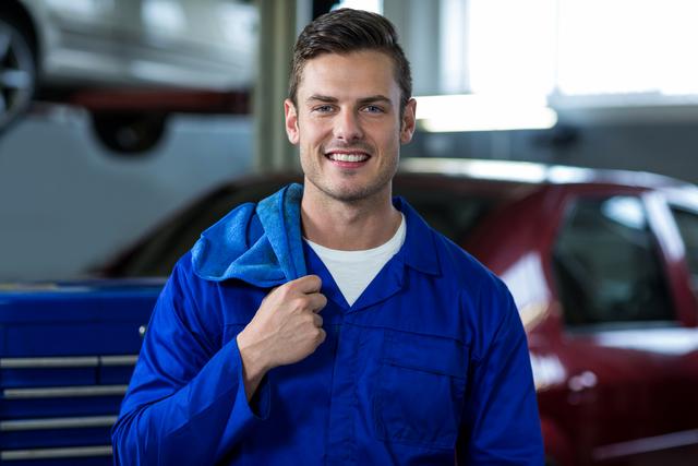 Portrait of mechanic smiling - Download Free Stock Photos Pikwizard.com
