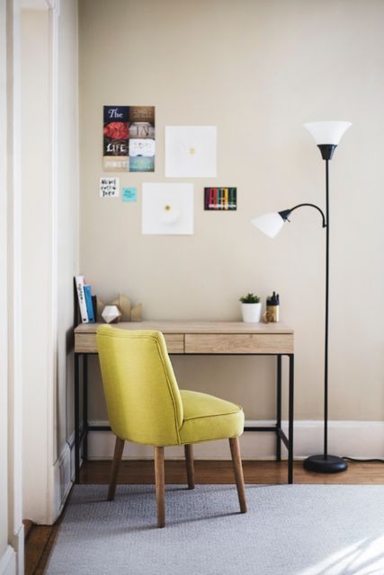 a home office with a desk, chair and lamp - Download Free Stock Photos Pikwizard.com