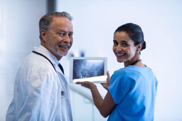 Doctor and nurse using digital tablet in hospital
