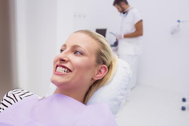 Woman showing her teeth in clinic - Download Free Stock Photos Pikwizard.com