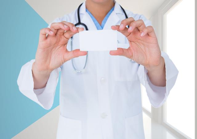 Mid-section of doctor holding blank placard 
