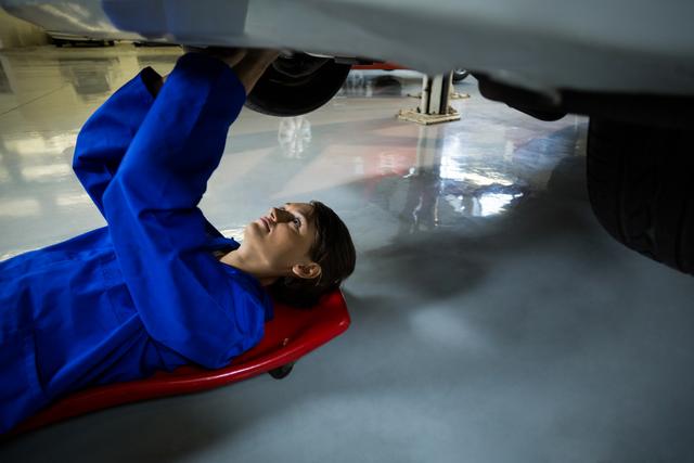 Female mechanic repairing a car - Download Free Stock Photos Pikwizard.com