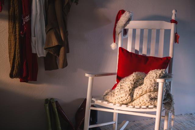 Wooden chair with red pillow and santa hat - Download Free Stock Photos Pikwizard.com