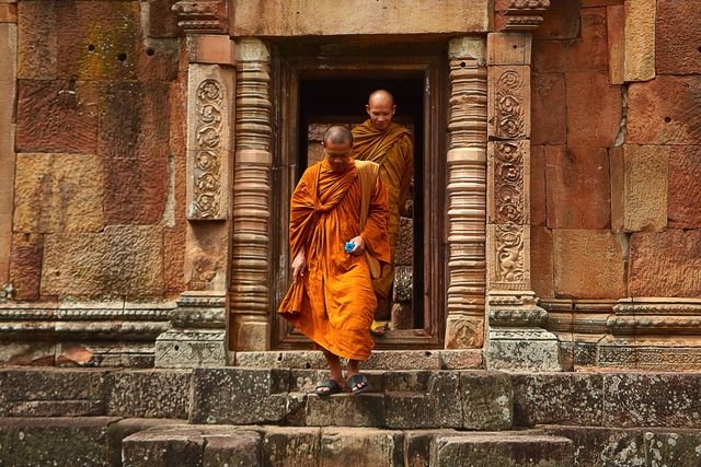 Two Monk in Orange Robe Walking Down the Concrete Stairs - Download Free Stock Photos Pikwizard.com