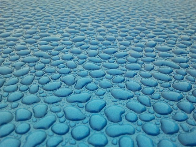 water droplets on a blue surface - Download Free Stock Photos Pikwizard.com