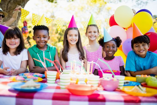 Group of children smiling and posing during a birthday party - Download Free Stock Photos Pikwizard.com