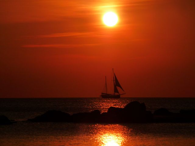 Sunset sailboat water- Download Free Stock Photos Pikwizard.com