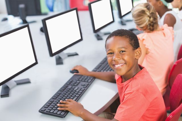 Schoolboy using computer in classroom - Download Free Stock Photos Pikwizard.com