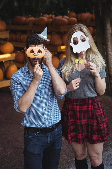 Couple wearing halloween mask - Download Free Stock Photos Pikwizard.com