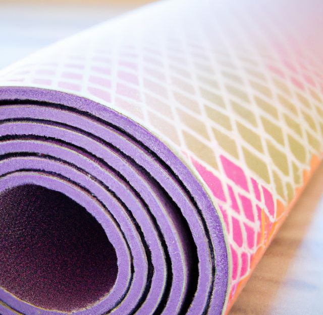 Image of close up of purple yoga mat with pattern. Yoga, exercise and exercise equipment concept.