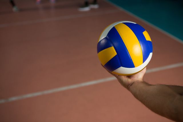Cropped hand of sportsperson with volleyball - Download Free Stock Photos Pikwizard.com
