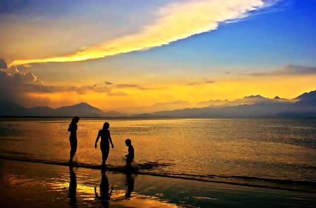 Silhouettes of 3 People in Body of Water during Dawn - Download Free Stock Photos Pikwizard.com