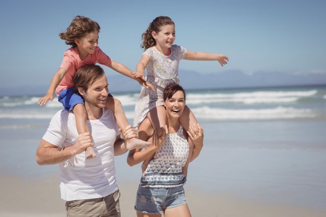 Cheerful family enjoying at beach - Download Free Stock Photos Pikwizard.com