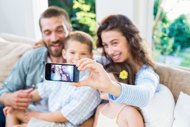 Happy family taking a selfie - Download Free Stock Photos Pikwizard.com