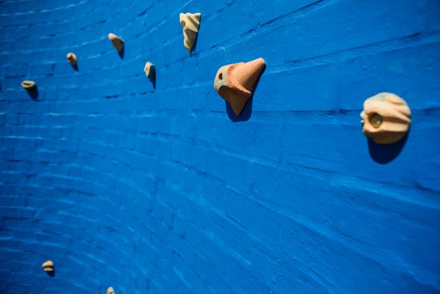 Full frame shot of blue climbing wall at school