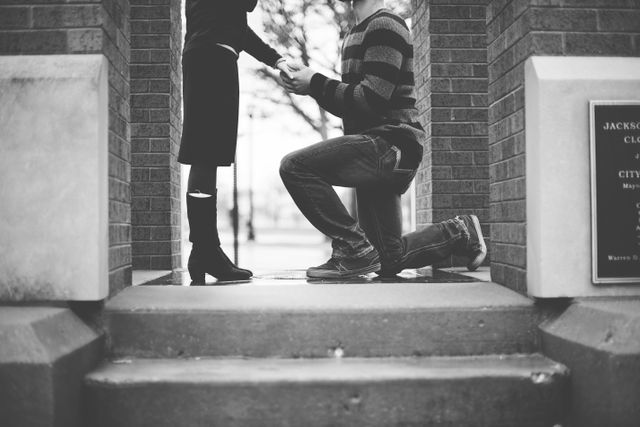 Black and white couple kneeling love - Download Free Stock Photos Pikwizard.com