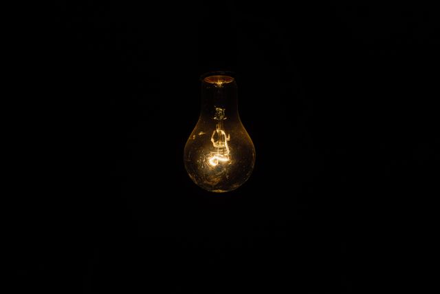 Light bulb lights dark - Download Free Stock Photos Pikwizard.com