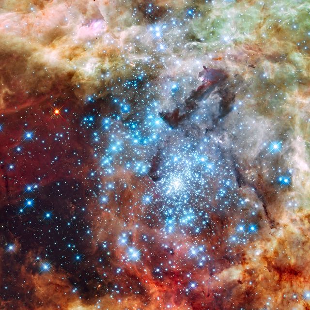 Image release August 16, 2012  Astronomers using data from NASA's Hubble Space Telescope have caught two clusters full of massive stars that may be in the early stages of merging. The 30 Doradus Nebula is 170,000 light-years from Earth. What at first was thought to be only one cluster in the core of the massive star-forming region 30 Doradus has been found to be a composite of two clusters that differ in age by about one million years.  The entire 30 Doradus complex has been an active star-forming region for 25 million years, and it is currently unknown how much longer this region can continue creating new stars. Smaller systems that merge into larger ones could help to explain the origin of some of the largest known star clusters. The Hubble observations, made with the Wide Field Camera 3, were taken Oct. 20-27, 2009. The blue color is light from the hottest, most massive stars; the green from the glow of oxygen; and the red from fluorescing hydrogen.  To read more about this image go to: <a href="http://www.nasa.gov/mission_pages/hubble/science/cluster-collision.html" rel="nofollow">www.nasa.gov/mission_pages/hubble/science/cluster-collisi...</a>  Image Credit: NASA, ESA, and E. Sabbi (ESA/STScI)  <b><a href="http://www.nasa.gov/audience/formedia/features/MP_Photo_Guidelines.html" rel="nofollow">NASA image use policy.</a></b>  <b><a href="http://www.nasa.gov/centers/goddard/home/index.html" rel="nofollow">NASA Goddard Space Flight Center</a></b> enables NASA’s mission through four scientific endeavors: Earth Science, Heliophysics, Solar System Exploration, and Astrophysics. Goddard plays a leading role in NASA’s accomplishments by contributing compelling scientific knowledge to advance the Agency’s mission.  <b>Follow us on <a href="http://twitter.com/NASA_GoddardPix" rel="nofollow">Twitter</a></b>  <b>Like us on <a href="http://www.facebook.com/pages/Greenbelt-MD/NASA-Goddard/395013845897?ref=tsd" rel="nofollow">Facebook</a></b>  <b>Find us on <a href="http://instagrid.me/nasagoddard/?vm=grid" rel="nofollow">Instagram</a></b>