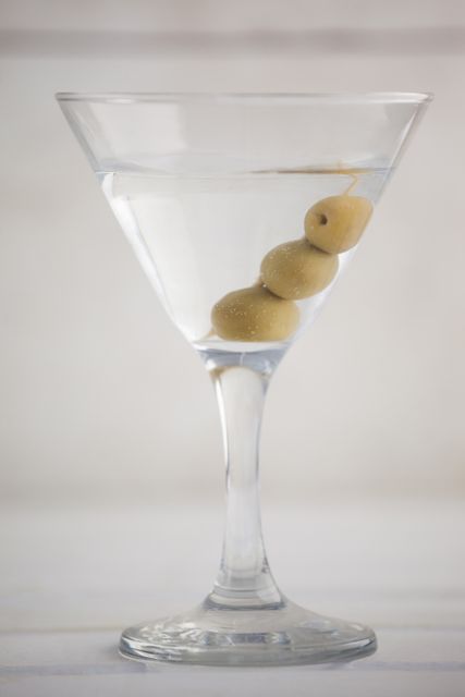 Close up of olives in martini glass - Download Free Stock Photos Pikwizard.com