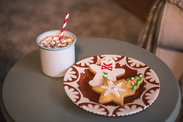 Gingerbread cookies with a cup of coffee on a table - Download Free Stock Photos Pikwizard.com