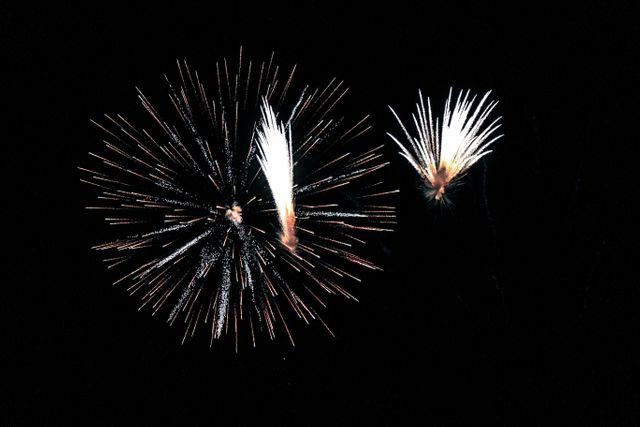 two fireworks that are in the dark - Download Free Stock Photos Pikwizard.com