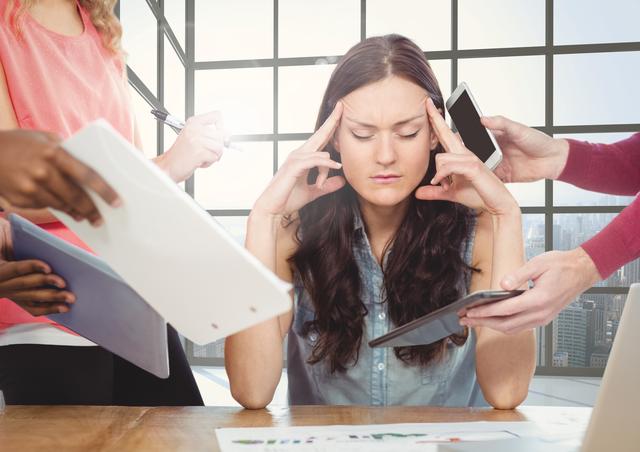 Stressed woman sitting with hands on forehead - Download Free Stock Photos Pikwizard.com