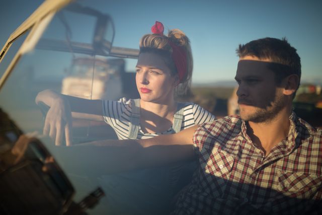 Couple sitting together in a car - Download Free Stock Photos Pikwizard.com