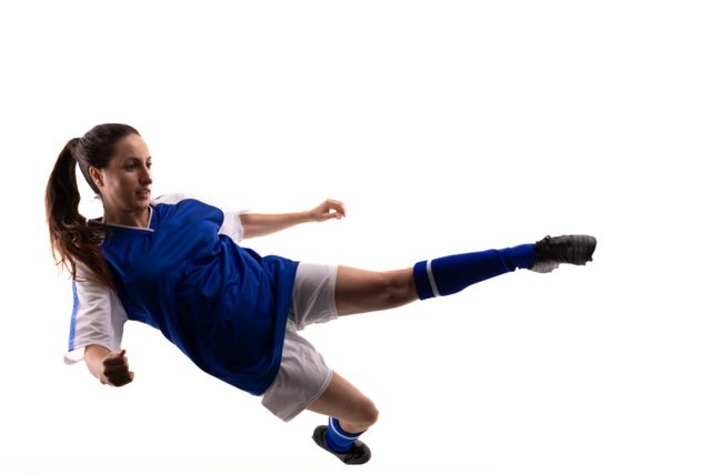 Full length of young female caucasian soccer athlete kicking mid-air against white background - Download Free Stock Photos Pikwizard.com