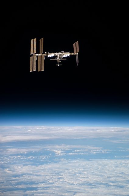 Flyaround view of the ISS taken from STS-123 Space Shuttle Endeavor - Download Free Stock Photos Pikwizard.com