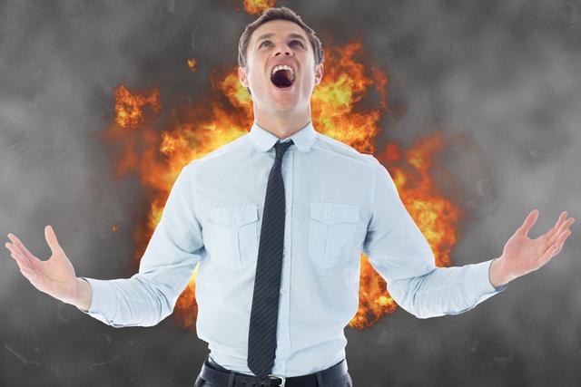 Angry businessman screaming with fire in background - Download Free Stock Photos Pikwizard.com