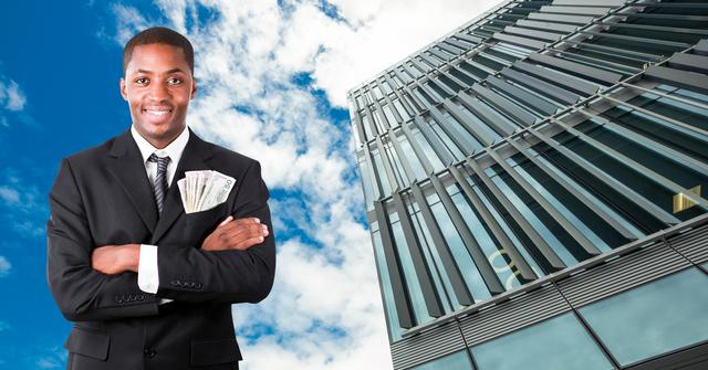 Successful businessman standing with currency in pocket - Download Free Stock Photos Pikwizard.com