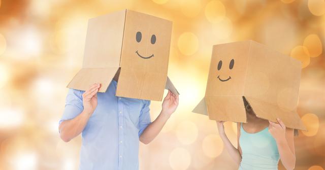 Couple with emojis on cardboard boxes over bokeh - Download Free Stock Photos Pikwizard.com
