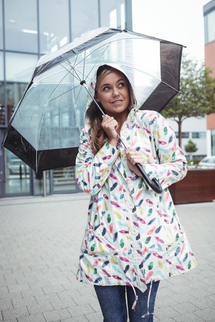 Beautiful woman holding umbrella - Download Free Stock Photos Pikwizard.com