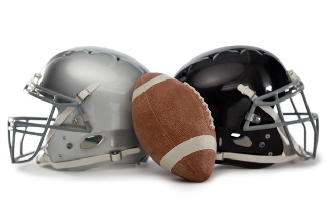 Close up of American football with helmets - Download Free Stock Photos Pikwizard.com
