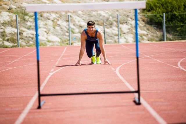 Athlete ready to jump a hurdle - Download Free Stock Photos Pikwizard.com