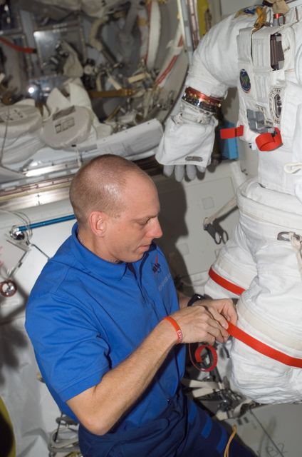 ISS015-E-15662 (2 July 2007) --- Astronaut Clayton C. Anderson, Expedition 15 flight engineer, works with an Extravehicular Mobility Unit (EMU) spacesuit in the Quest Airlock of the International Space Station.