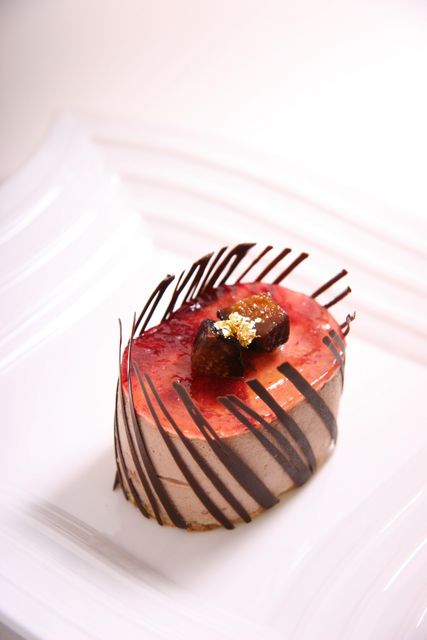 Red and Brown Oval Shape Chocolate Pastry on Ceramic Plate - Download Free Stock Photos Pikwizard.com