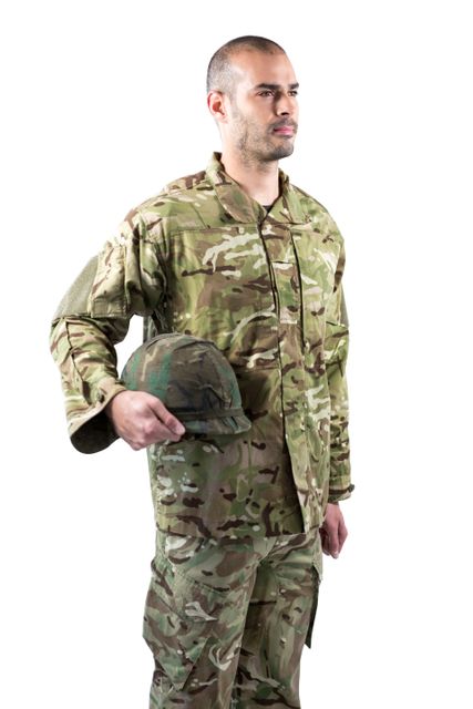 Confident soldier standing with a helmet - Download Free Stock Photos Pikwizard.com