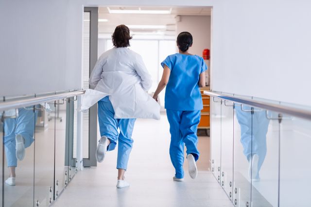 Nurse and doctor running in hospital corridor - Download Free Stock Photos Pikwizard.com