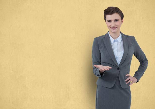 Confident businesswoman gesturing over beige background - Download Free Stock Photos Pikwizard.com