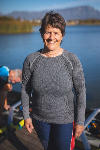 Portrait of senior caucasian woman from rowing club smiling to camera by the river - Download Free Stock Photos Pikwizard.com