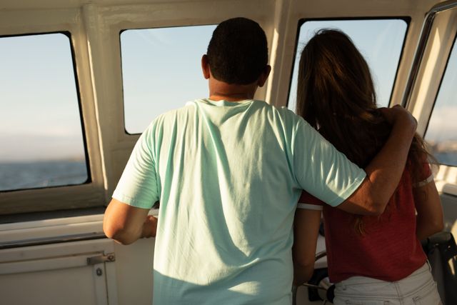 Rear view of couple looking through window on a boat - Download Free Stock Photos Pikwizard.com