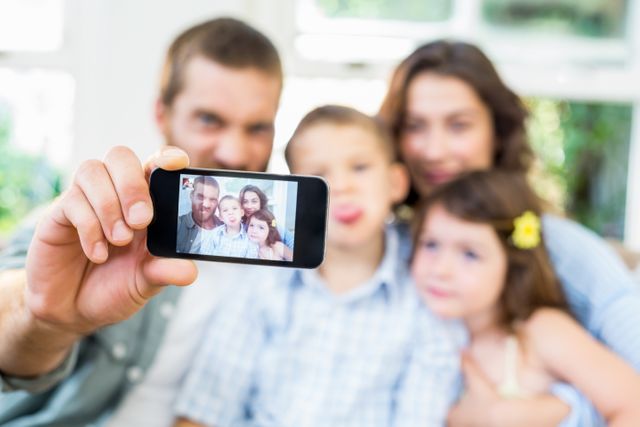 Happy family taking a selfie - Download Free Stock Photos Pikwizard.com