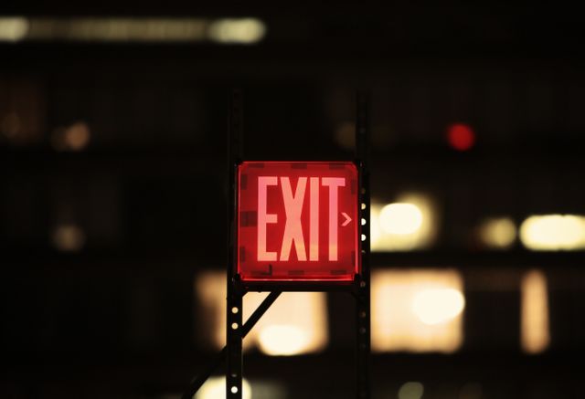 a red exit sign - Download Free Stock Photos Pikwizard.com